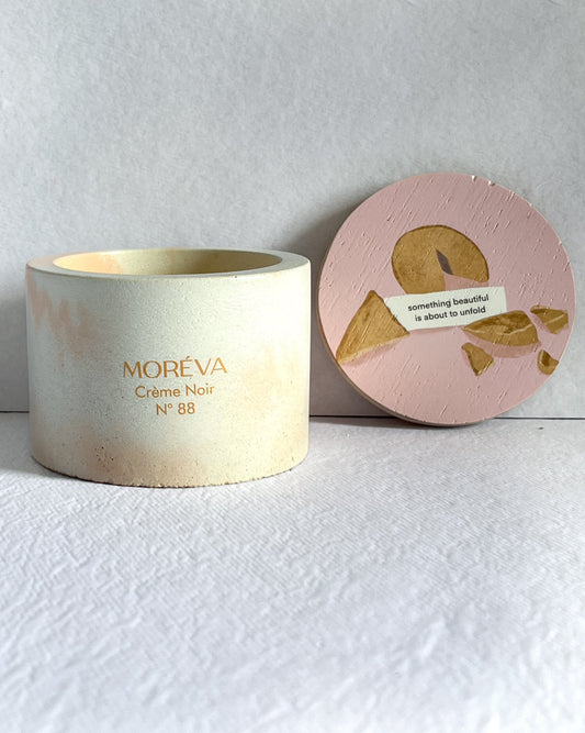 a scented candle by moreva that smells like vanilla