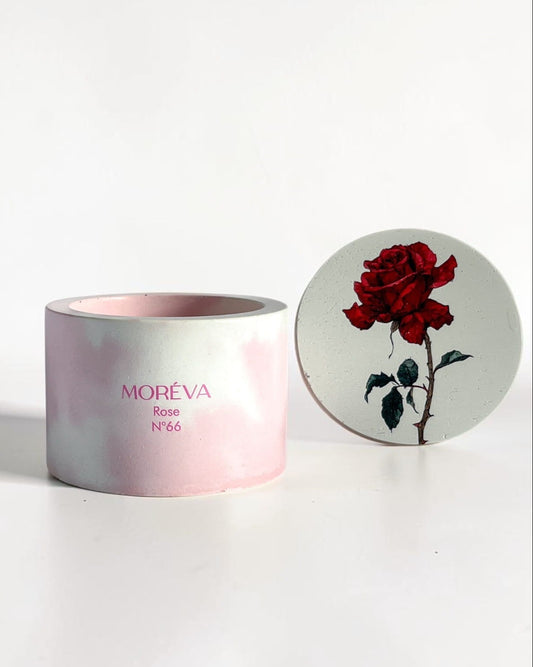 a designer lid with a rose scented candle