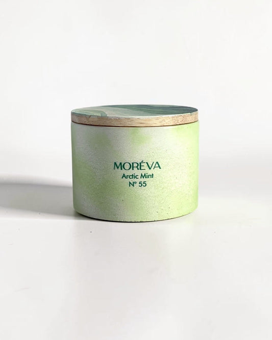 A candle by moreva that smells like mint