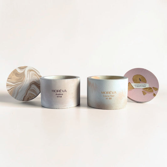A pack of 2 candles that smell like coffee and vanilla