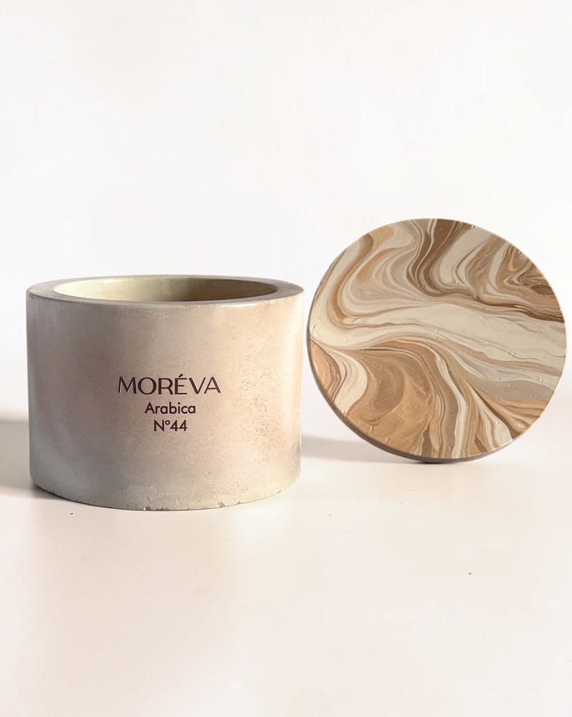 a candle by moreva that smells like a roasted coffee beans