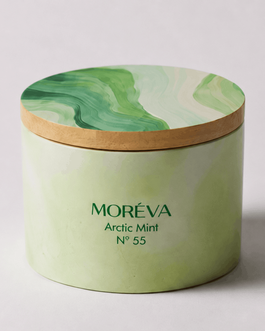 Green jar of a scented candle with wooden lid
