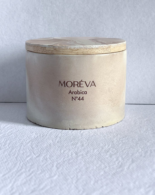 a concrete jar candle that smells like coffee