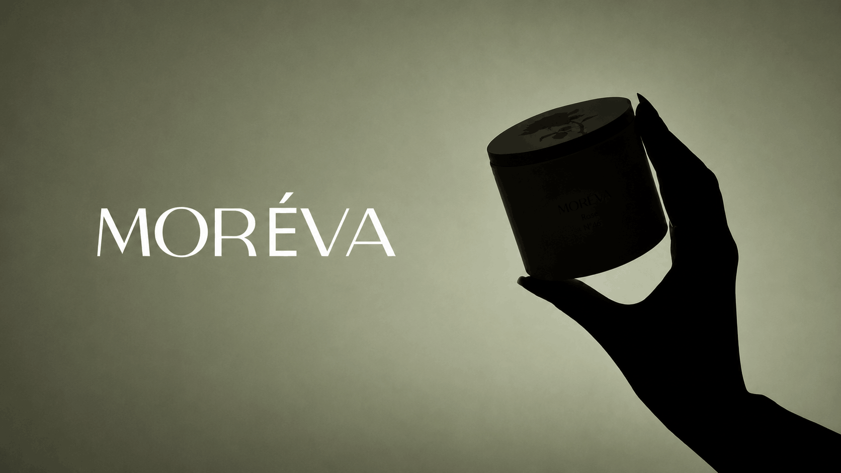 a silhouette of a candle and lid with brand name