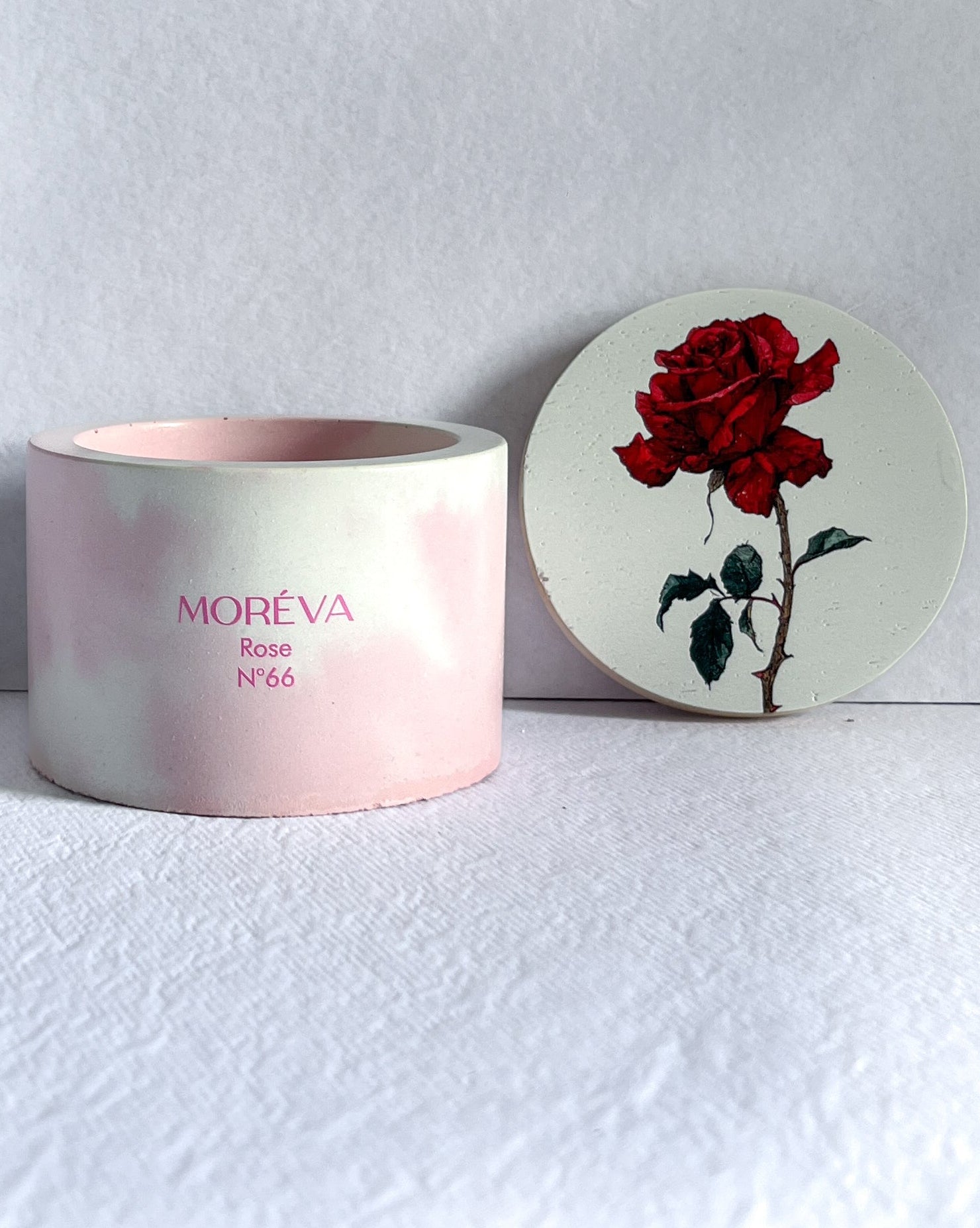 pink concrete jar candle that smells like rose